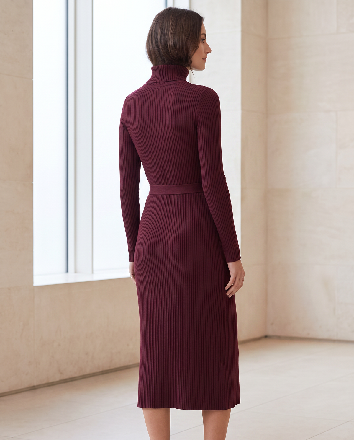 Back view of The Cinch Knit Dress in wine with long sleeves and midi silhouette